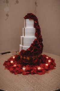4 tier cake decorated with roses at Baton Renaissance Hotel wedding