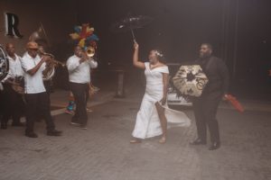 bride and groom and second line band dance at Baton Renaissance Hotel wedding